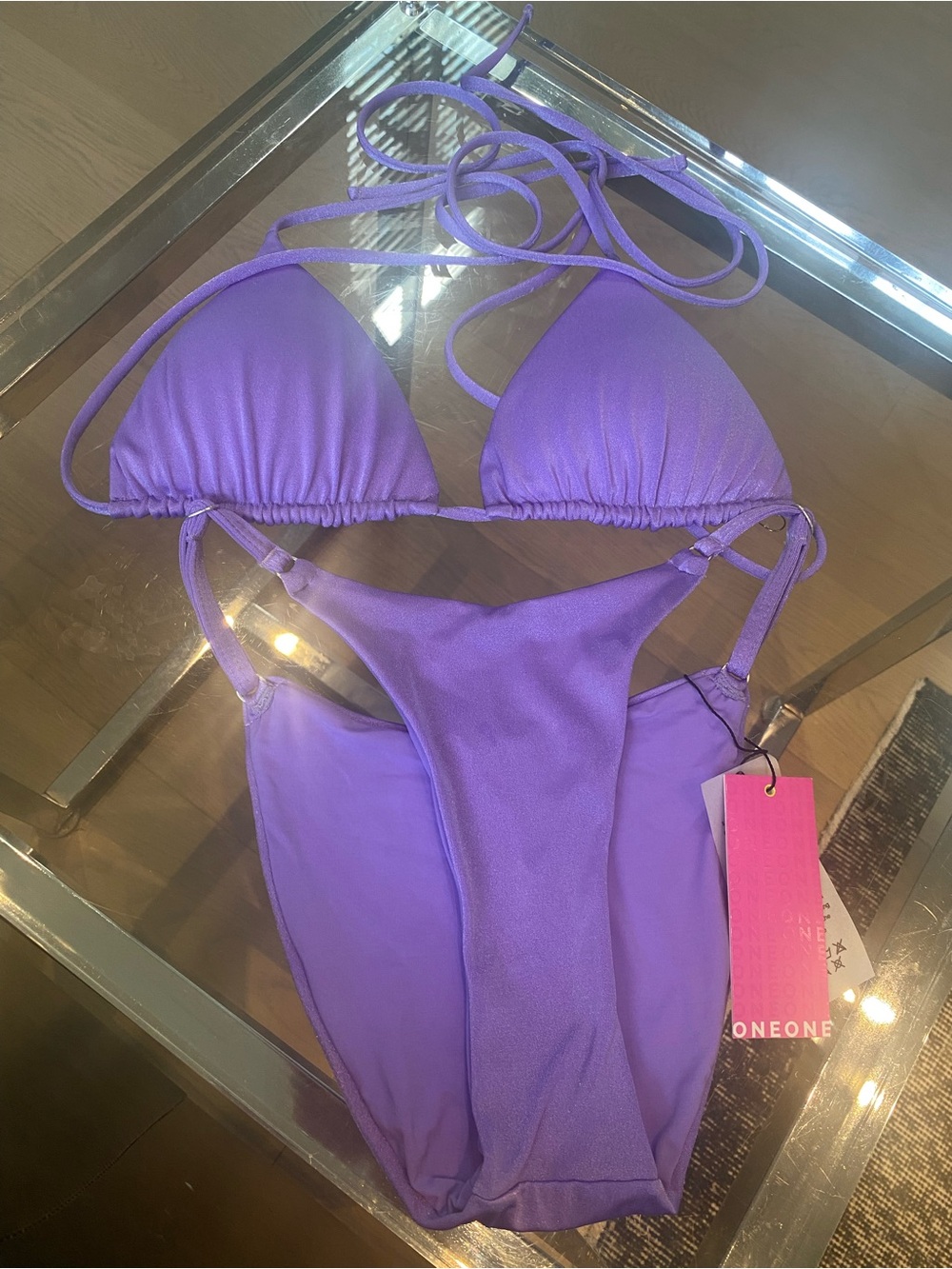 One one Bikini metallic purple new top is large, bottom are small